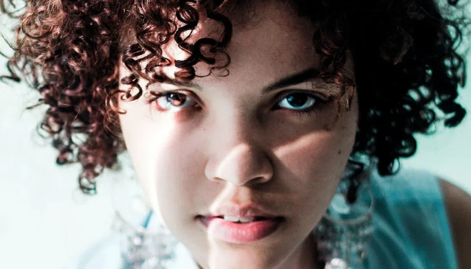 A young woman getting ready and looking ahead with confidence